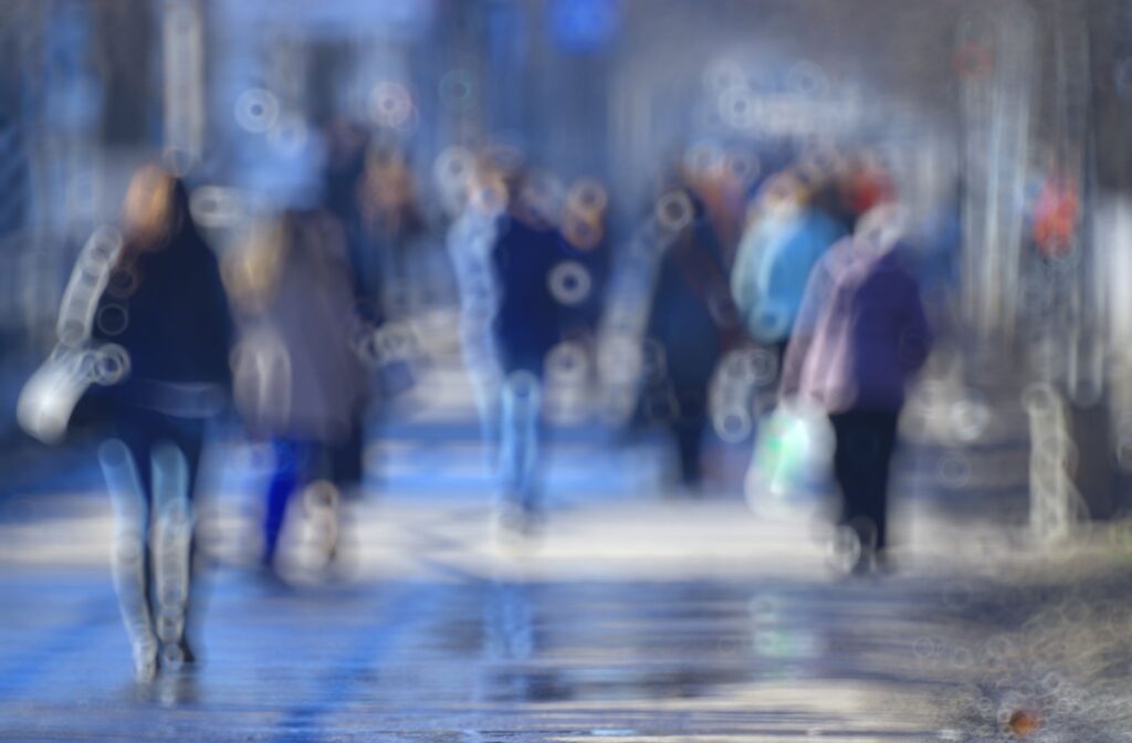 A photo of an urban street in the day time, blurred and unfocused.